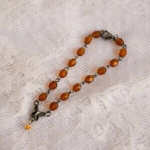 Vintage-Inspired Orange Glass Bead Bracelet with Butterfly Pendant